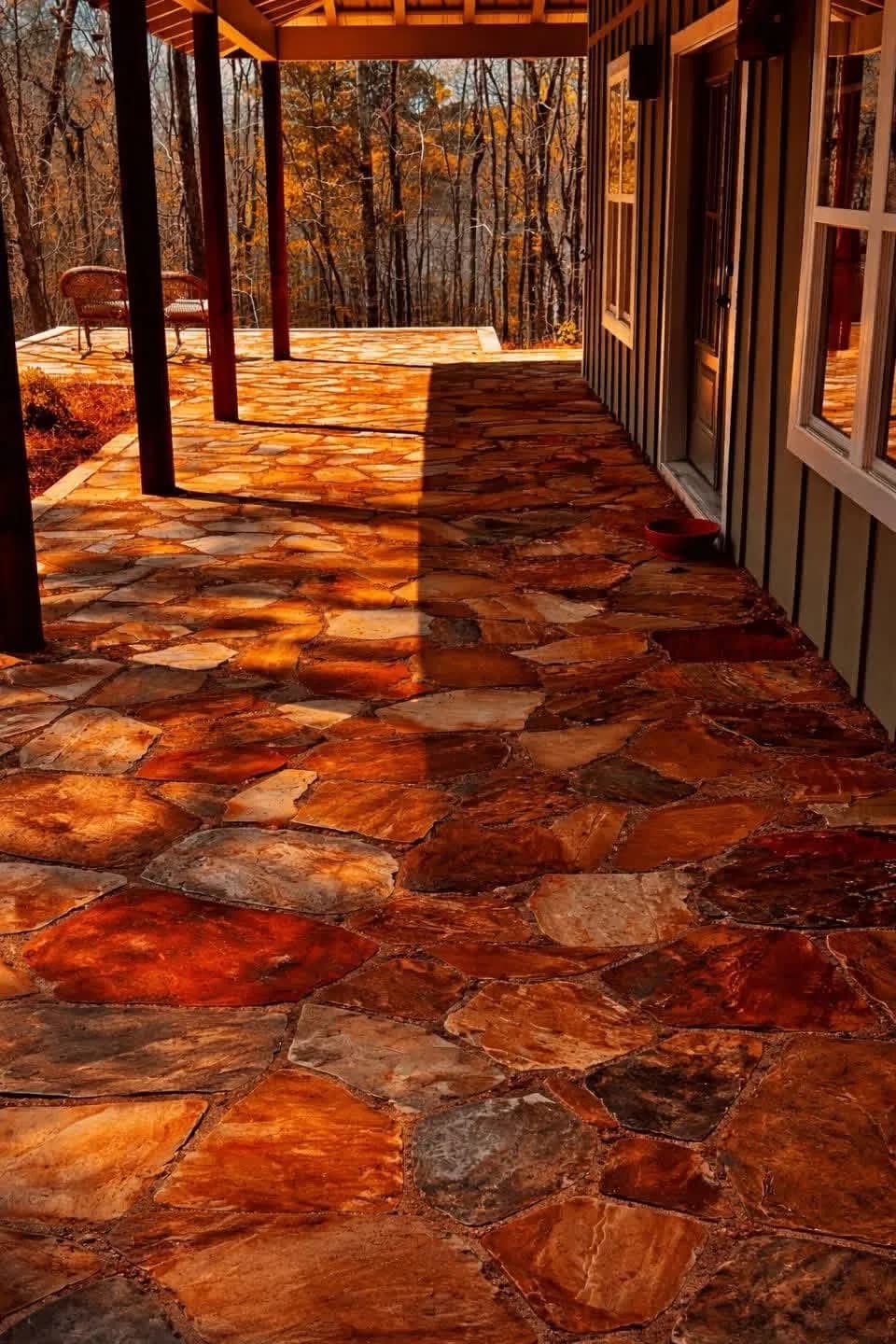 Natural flagstone patio floor under a covered back porch